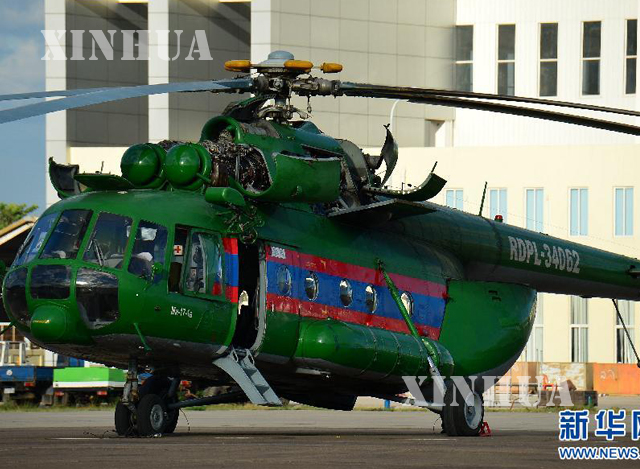 လာအုိႏိုင္ငံ၏ စစ္ဘက္ Mi-17 ရဟတ္ယာဥ္တစ္စင္း အား ျမင္ေတြ႕ရစဥ္ (ဆင္ဟြာ)