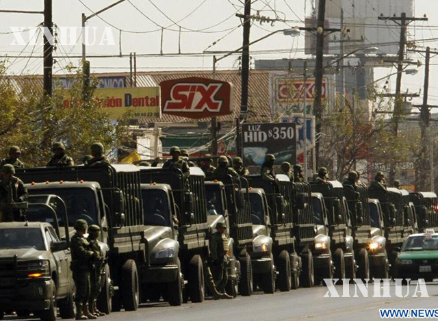 ထောင်တွင်းဆူပူအုံကြွမှုဖြစ်ပွားသည့် တိုပို ချီကို အကျဉ်းထောင်သို့ မက္ကဆီကို စစ်တပ်ရောက်ရှိလာစဉ် (Xinhua)