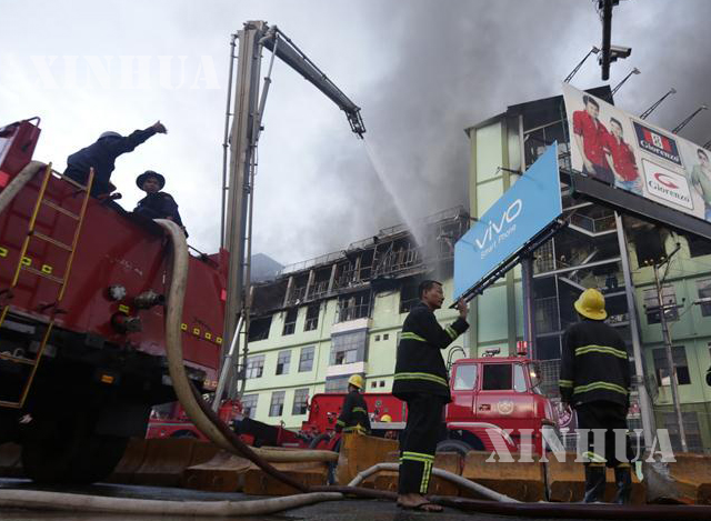 ရန်ကုန်မြို့ မင်္ဂလာဈေး မီးလောင်မှု အား မီးသတ် တပ်ဖွဲ့ဝင်များက မီးငြိမ်းသတ် ပြီးနောက် တွေ့ရစဉ် (ဆင်ဟွာ)