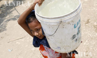 ရေရှားပါးမှုကြောင့် သောက်သုံး ရေခပ်လာသော ကလေးငယ် တစ်ဦးအား တွေ့ရစဉ် (ဆင်ဟွာ)