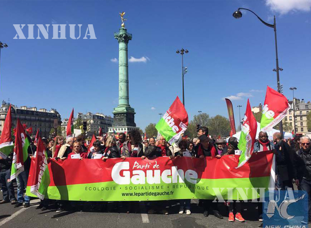 ပြင်သစ်နိုင်ငံ ပါရီမြို့တွင် မေလ ၁ ရက်က အလုပ်သမားများ ဆန္ဒပြနေစဉ် (ဆင်ဟွာ)