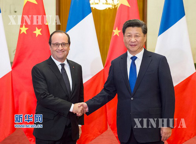 တရုတ်သမ္မတ ရှီကျင့်ဖိန် နှင့် ပြင်သစ်သမ္မတ ဖရန်ကိုစ်ဟော်လန်ဒီ တို့နှစ်ဦးအား တွေ့ရစဉ်(ဆင်ဟွာ)