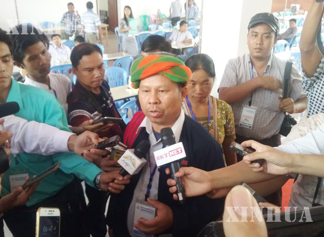 ပအိုဝ်း အမျိုးသား လွတ်မြောက်ရေး အဖွဲ့ချုပ်(PNLO)မှ ခွန်မြင့်ထွန်းအား တွေ့ရစဉ်(ဆင်ဟွာ)