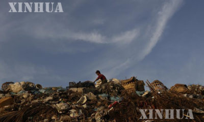 ရန်ကုန်မြို့တွင်းတစ်နေရာရှိ စွန့်ပစ်အမှိုက်များကို တွေ့ရစဉ် (ဆင်ဟွာ)