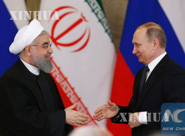 အီရန္ႏိုင္ငံ သမၼတ Hassan Rouhani (ဝဲ) ႏွင့္ ရုရွားႏို္င္ငံ သမၼတ ဗလာဒီမာ ပူတင္ (ယာ) တို႔အား ေတြ႕ရစဥ္ (ဆင္ဟြာ)