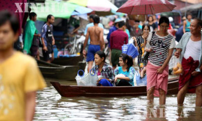 ကရင္ျပည္နယ္တြင္း ေရႀကီးမႈေၾကာင့္ ေလွမ်ားျဖင့္ သြားလာေနမႈအား ေတြ႔ရစဥ္(ဆင္ဟြာ)