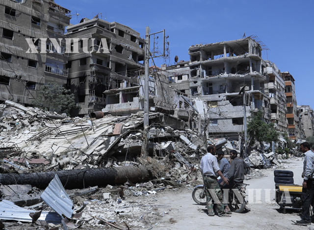 ဆီးရီးယား ႏုိင္ငံ တြင္ တိုက္ပြဲေၾကာင့္ ပ်က္ဆီး ခဲ့ရသည့္ အေဆာက္အဦ မ်ားအား ျမင္ေတြ႕ရစဥ္(ဆင္ဟြာ)