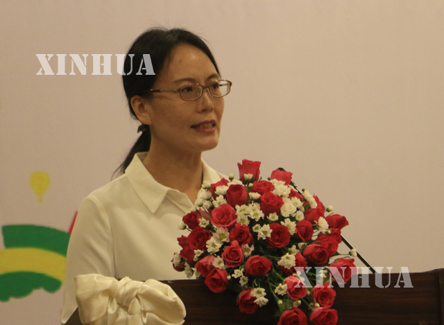 ျမန္မာႏိုင္ငံဆိုင္ရာ တရုတ္ျပည္သူ ့ သမၼတႏိုင္ငံ သံရုံးမွ Minister Counsellor Ms. Li Xiao Yan အဖြင့္ အမွာစကား ေျပာၾကားစဥ္ (ဆင္ဟြာ)