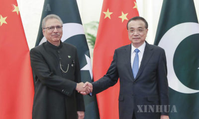 တရုတ်နိုင်ငံ ဝန်ကြီးချုပ် လီခဲ့ချန်နှင့် ပါကစ္စတန်နိုင်ငံ သမ္မတ အာရစ်ဖ် အယ်လ်ဗီတို့ မတ် ၁၇ ရက်က ပေကျင်းမြို့၌ တွေ့ဆုံစဉ် (ဆင်ဟွာ)