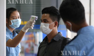 ရန်ကုန်မြို့တွင်း COVID-19 ရောဂါကာကွယ်ရန် mask တပ်ဆင်သွားလာနေသူတစ်ဦးအား တွေ့ရစဉ်(ဆင်ဟွာ)