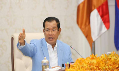 ကမ္ဘောဒီးယားနိုင်ငံ ဝန်ကြီးချုပ် ဆမ်ဒက် တက်ခ်ချို ဟွန်ဆန်အား COVID-19 နောက်ဆုံးအခြေအနေနှင့် ပတ်သက်ပြီး သတင်းစာရှင်းလင်းပွဲ၌ တွေ့ရစဉ် (ဆင်ဟွာ)