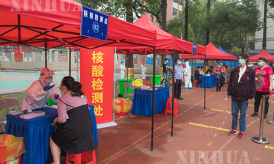တရုတ်နိုင်ငံ ဝူဟန့်မြို့တွင် COVID-19ရောဂါ စစ်ဆေးနေမှုများအား တွေ့ရစဉ်(ဆင်ဟွာ)