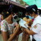 ရန်ကုန်မြို့ရှိပြည်သူများအား COVID-19 ကြိုတင်ကာကွယ်ရေးအဖြစ် ကျန်းမာရေးစစ်ဆေးမှုများပြုလုပ်စဉ်(ဆင်ဟွာ)