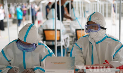 တရုတ်နိုင်ငံ ပေကျင်းမြို့၌ COVID-19ရောဂါ စစ်ဆေးမှုပြုလုပ်ပေးနေသည်ကို ဇွန် ၂၄ ရက် က တွေ့ရစဉ် (ဆင်ဟွာ)