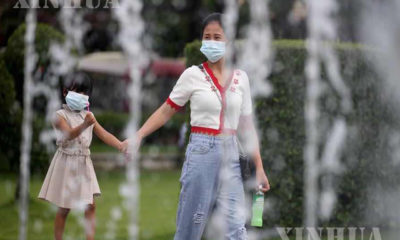 COVID-19 ရောဂါကူးစက်ပျံ့နှံ့မှုကိုကာကွယ်နိုင်ရန် ရန်ကုန်မြို့အတွင်းနှာခေါင်းစည်းများ တပ်ဆင်သွားလာနေမှုအား တွေ့ရစဉ် (ဆင်ဟွာ)