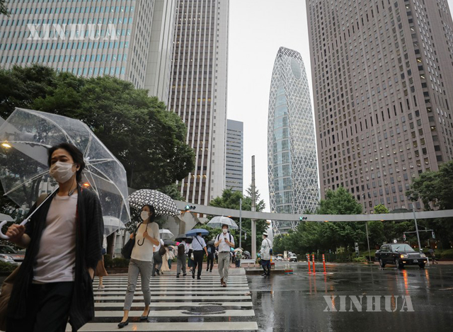 ဂျပန်နိုင်ငံ တိုကျိုမြို့တွင် နှာခေါင်းစည်းတပ်ဆင်ထားသူများအား တွေ့ရစဉ် (ဆင်ဟွာ)
