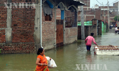 အိန္ဒိယနိုင်ငံတွင် ရေကြီးမှု ဖြစ်ပွားနေသည့်မြင်ကွင်းများကို တွေ့ရစဉ်(ဆင်ဟွာ)