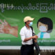 ရန်ကုန်မြို့၌ နှာခေါင်းစည်း တပ်ဆင်သွားလာသူတစ်ဦးအား တွေ့ရစဉ်(ဆင်ဟွာ)