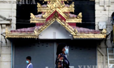 ရန်ကုန်မြို့တွင်း နှာခေါင်းစည်း တပ်ဆင်သွားလာသူများအား တွေ့ရစဉ်(ဆင်ဟွာ)