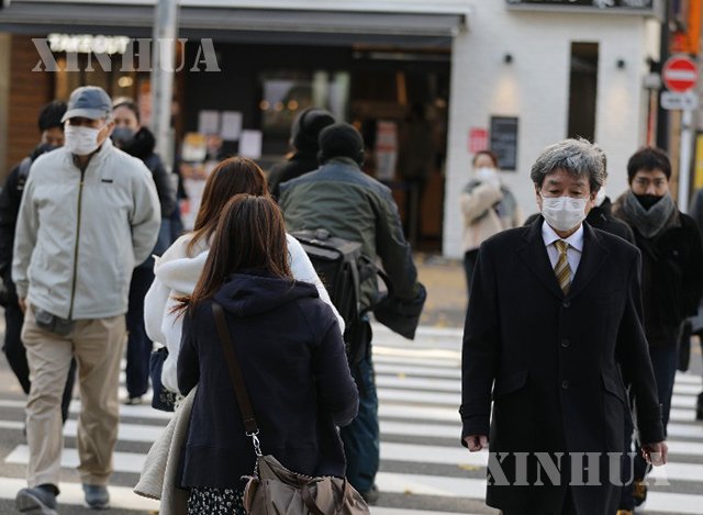 ဂျပန်နိုင်ငံ တိုကျိုမြို့တွင် နှာခေါင်းစည်းတပ်သွားလာနေသူများအား ဇန်နဝါရီ ၇ ရက်က တွေ့ရစဉ်(ဆင်ဟွာ)