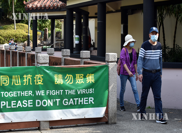 တရုတ်နိုင်ငံ ဟောင်ကောင် အထူးအုပ်ချုပ်ခွင့်ရဒေသတွင် နှာခေါင်းစည်းတပ်သွားလာနေသူများအား ဇန်နဝါရီ ၂၆ ရက်က တွေ့ရစဉ် (ဆင်ဟွာ)